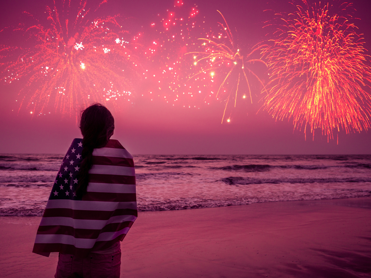Child on the beach watching fireworks